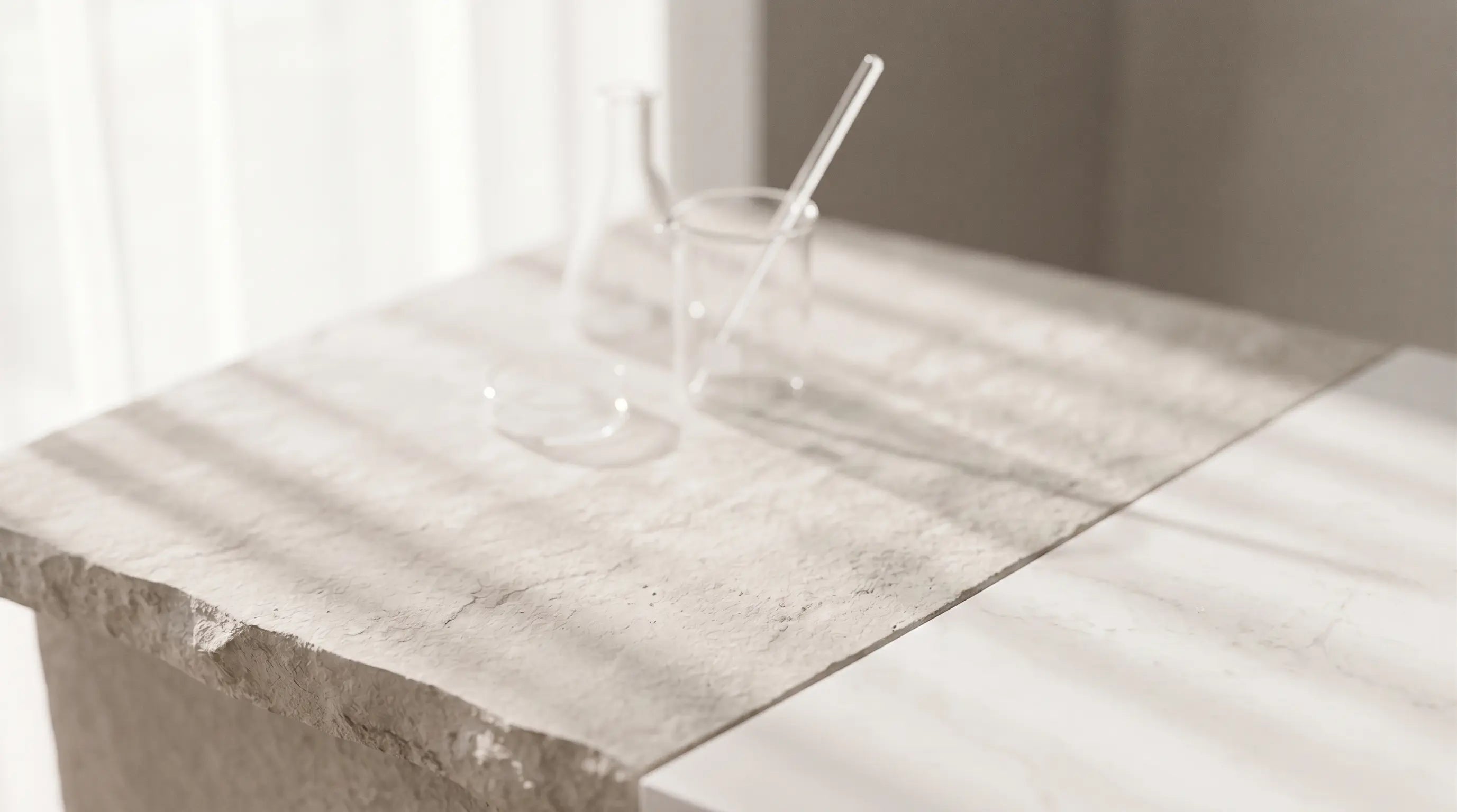 Soft clinical glassware on a light stone surface for a premium wellness science settingslider_item_K6h6WJ